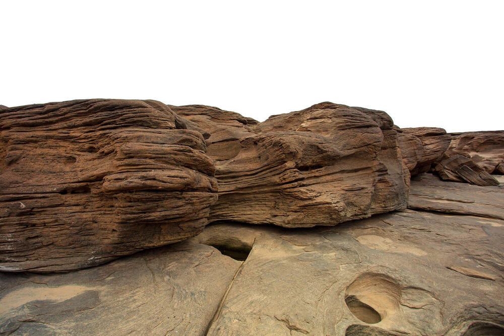 Source photograph: layered sandstone rock cut out on white.