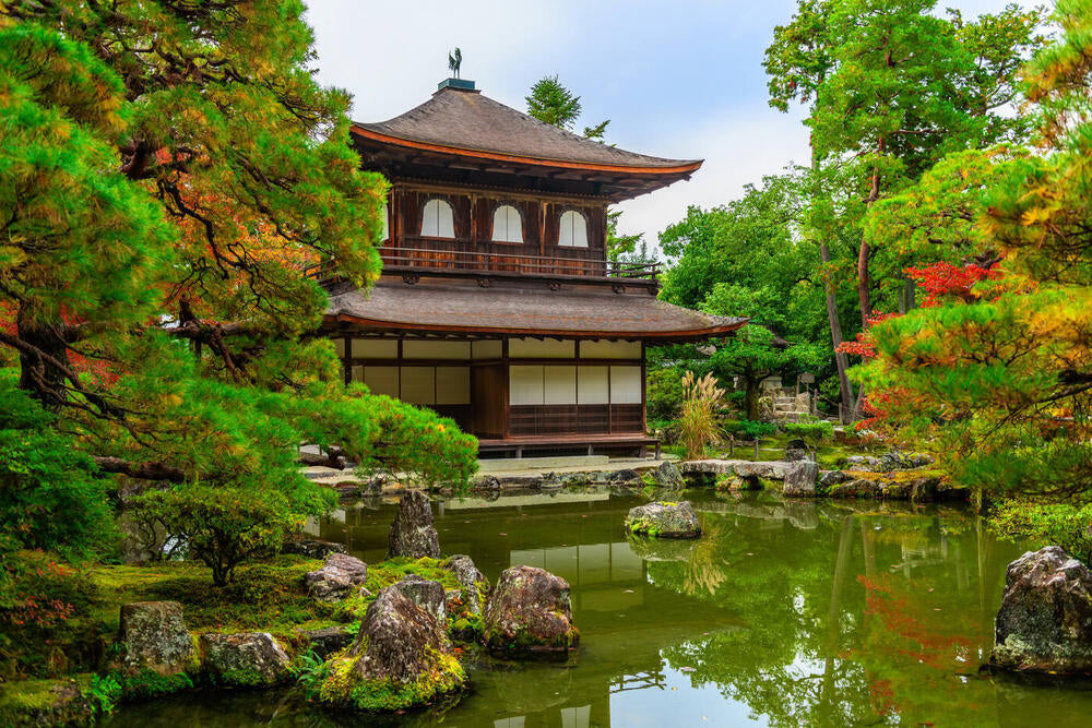 Source photograph: a temple pavilion beside a still green pond.