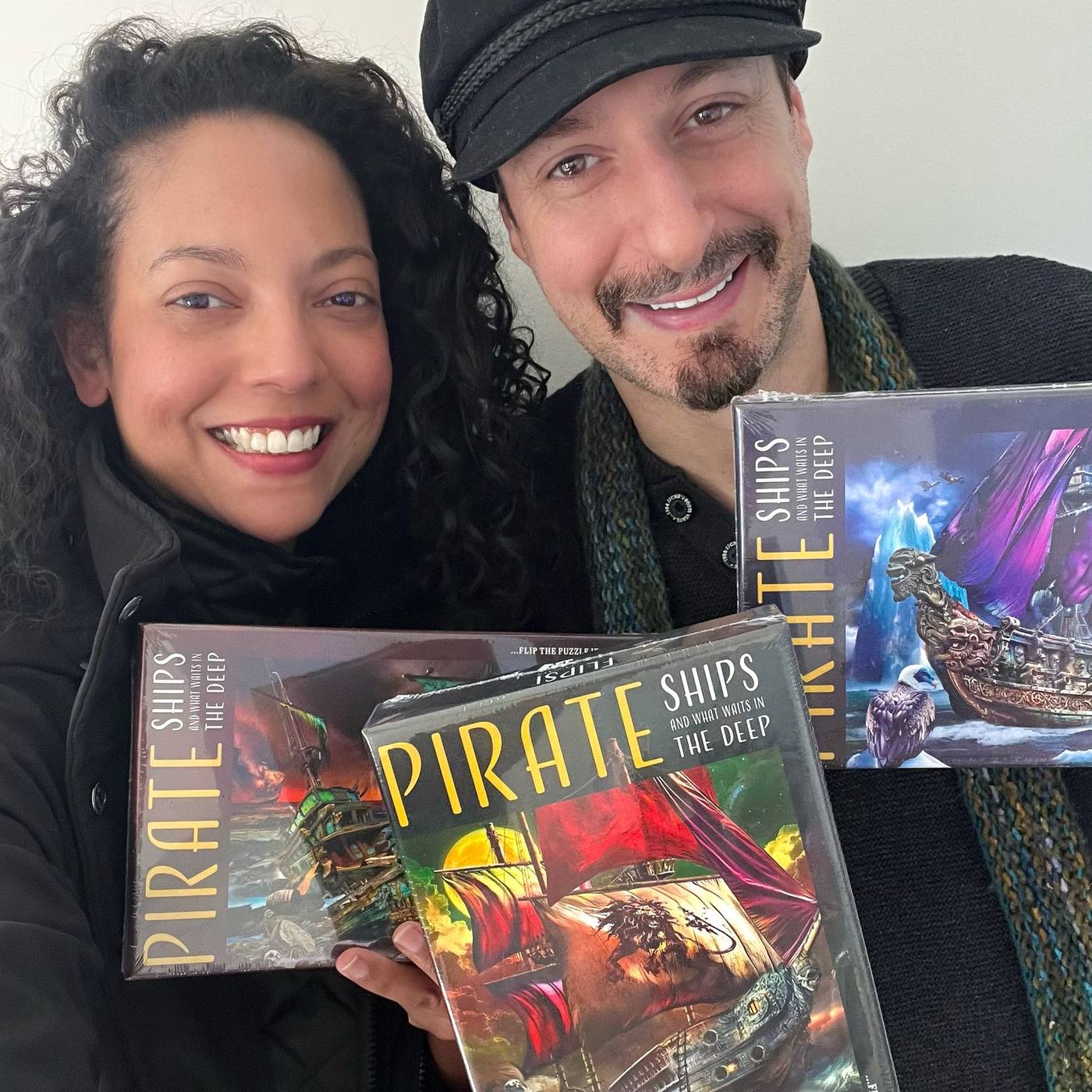 Demi and Melissa holding sealed Pirate Ships Flipsi puzzles
